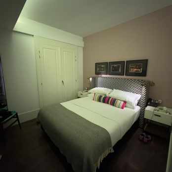 The Lumiares Hotel & Spa - Turndown service every night with cookies under glass on a Lisbon tile. Wood shutters over each balcony kept it dark and quiet in our room. - Hotels Near Me - Lisbon, 11