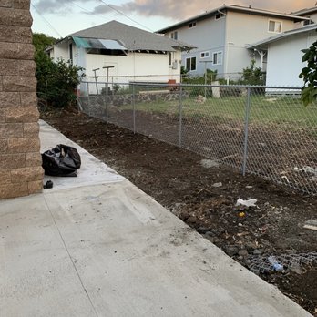Elite Masons - AFTER - the end result after removing all the trees and pouring a new sidewalk. The entire fencing area used to be covered with tall trees. - Masonry/Concrete Near Me - Kapolei, Hawaii