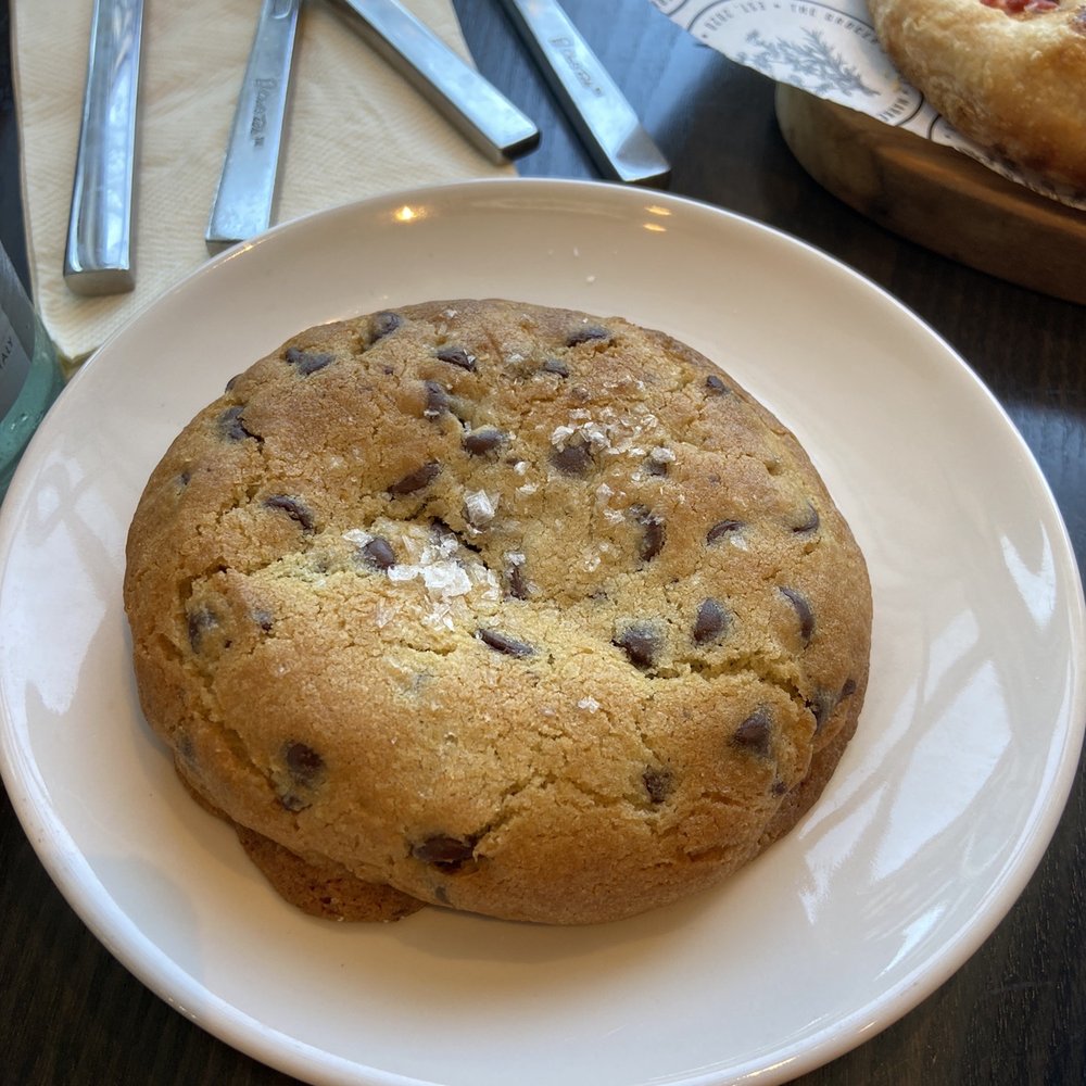 The Grocer's Table - The perfect rustic chocolate chip cookie with sea salt sprinkled on top. - Cafes Near Me - Wayzata, Minnesota The Grocer's Table - The perfect rustic chocolate chip cookie with sea salt sprinkled on top. - Cafes Near Me - Wayzata, Minnesota