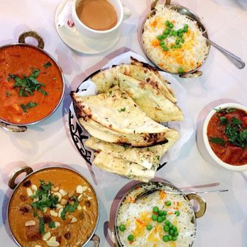 Diwan - Clockwise: tea, rice, chicken tikka masala, rice again, malai kofta and shai paneer. Middle: garlic naan. - Indian Near Me - Port Washington, New York Diwan - Clockwise: tea, rice, chicken tikka masala, rice again, malai kofta and shai paneer. Middle: garlic naan. - Indian Near Me - Port Washington, New York