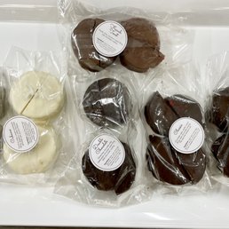 chocolate covered pastries in a plastic container chocolate covered pastries in a plastic container