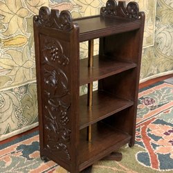 Carved Arts & Crafts rotating bookcase. British. Original finish.