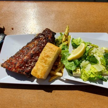Joe's Farm Grill - Half slab baby back ribs, garlic fries, bread and a salad - American Near Me - Gilbert, Arizona Joe's Farm Grill - Half slab baby back ribs, garlic fries, bread and a salad - American Near Me - Gilbert, Arizona