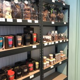 Inside, eco-friendly reusable coffee mugs and chocolates.