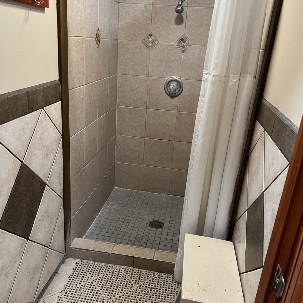 American Heritage RV Park - Shower stall inside the bathhouse - RV Parks Near Me - Williamsburg, Virginia