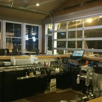 Bernies Beach Bar - Garage doors open up towards the beach and desk. - Bars Near Me - Hampton, New Hampshire