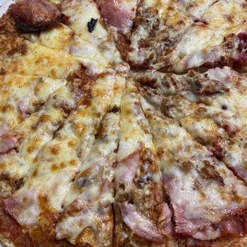 Moose's Saloon - Meat lovers- Canadian bacon, sausage, pepperoni and breakfast bacon - Pizza Near Me - Kalispell, Montana