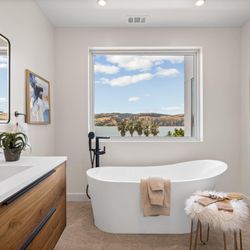 Organic modern bathroom design, showcasing our Parker bathroom vanity collection in Natural Walnut.