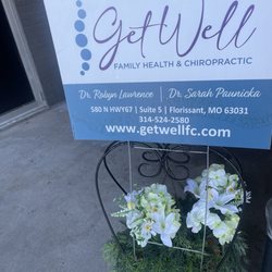 Get Well Family Chiropractic - Information sign at the entrance.