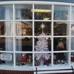 Andrea's Family Hair Care - The holiday cheer presented in the window is in sharp contrast to cold-hearted, nasty woman who works inside.