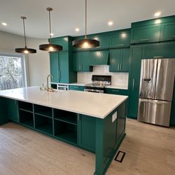 Urbanomic Interiors - Kitchen renovation with elimination of structural wall to open up space.  Custom cabinetry design, full service project implementation.