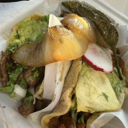 Left: Carne Asada taco Right: Grilled Pork taco