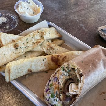 Spitz - Frisco - Street Car wrap with fried pita strips. PS- I had already scarfed half of the wrap and most of the pita strips by the time I took the photo. - Mediterranean Near Me - Frisco, Texas Spitz - Frisco - Street Car wrap with fried pita strips. PS- I had already scarfed half of the wrap and most of the pita strips by the time I took the photo. - Mediterranean Near Me - Frisco, Texas