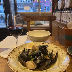 Cavistons Seafood Restaurant - Glass of red wine and the clams & mussels dish