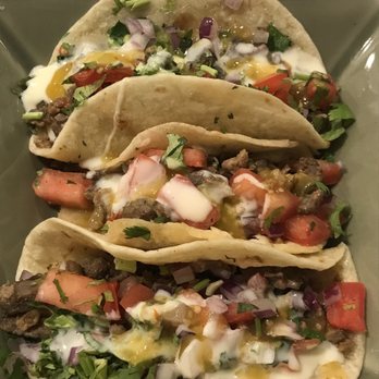 Jalapeños Mexican Eats - Steak tacos with tomatoes, cilantro, onions, house tomatillo sauce & queso. We had 2 on corn & 2 on flour tortillas. Both equally as good! - Mexican Near Me - Maitland, Florida Jalapeños Mexican Eats - Steak tacos with tomatoes, cilantro, onions, house tomatillo sauce & queso. We had 2 on corn & 2 on flour tortillas. Both equally as good! - Mexican Near Me - Maitland, Florida