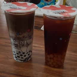 Black charcoal latte with sesame boba & tin guan yin with sweet potato boba