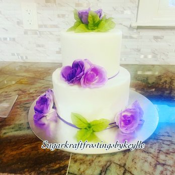 SugarKraft Frostings By Key - a white cake with purple flowers - Custom Cakes Near Me SugarKraft Frostings By Key - a white cake with purple flowers - Custom Cakes Near Me