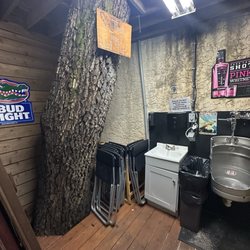 L J Schooners Dockside Restaurant & Oyster Bar - Tree in the men's restroom...super cool