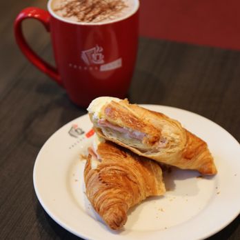 Presse Café - Egg and ham croissant. Hot chocolate in the background - Cafes Near Me - Toronto, Ontario Presse Café - Egg and ham croissant. Hot chocolate in the background - Cafes Near Me - Toronto, Ontario