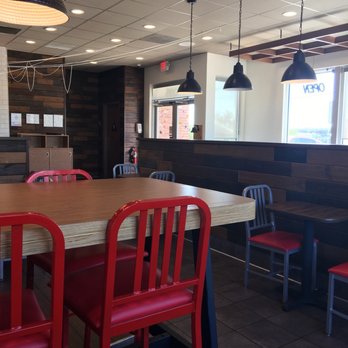 Arby's - a dining room with red chairs - Fast Food Near Me - New Braunfels, Texas