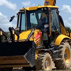 Diggerland Theme Parks - A backhoe that anyone can drive with assistance, thank goodness!
