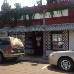 Johnson Street Fish House - Grass growing all over the front entrance of business