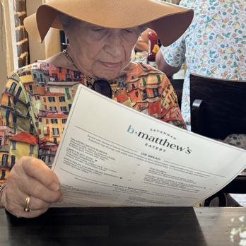 B Matthews Eatery - 90 year old enjoying menu. - New American Near Me - Savannah, Georgia