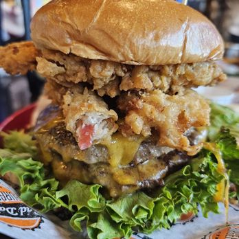 Bad Daddy's Burger Bar - Bad Ass Burger - two 5 oz beef patties with Housemade american cheese, buttermilk fried bacon, horseradish mayo, lettuce, tomato & pickle. - Burgers Near Me - Madison, Alabama Bad Daddy's Burger Bar - Bad Ass Burger - two 5 oz beef patties with Housemade american cheese, buttermilk fried bacon, horseradish mayo, lettuce, tomato & pickle. - Burgers Near Me - Madison, Alabama