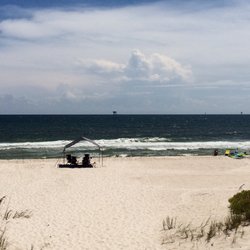 Beach Bum Services - Our tent and chairs stayed up all week. The neighbors canopies broke in a wind storm. Our Beach Bum tent was the only one standing!!!