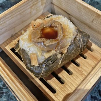 Lai Wah Heen - Abalone & Dried Scallops Sticky Rice in Lotus Leaf (with salted egg yolk and mushrooms) - Dim Sum Near Me - Toronto, Ontario Lai Wah Heen - Abalone & Dried Scallops Sticky Rice in Lotus Leaf (with salted egg yolk and mushrooms) - Dim Sum Near Me - Toronto, Ontario