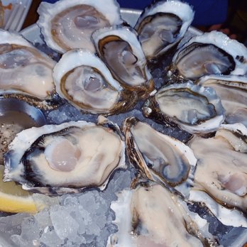 Taylor Shellfish Farms - Shucker's Dozen - twelve oysters served with champagne mignonette & lemon $33 - Seafood Near Me - Seattle, Washington Taylor Shellfish Farms - Shucker's Dozen - twelve oysters served with champagne mignonette & lemon $33 - Seafood Near Me - Seattle, Washington