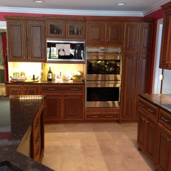 Provenzano Design & Remodel - a kitchen with wood cabinets and granite countertops - General Contractors Near Me - Danbury, Connecticut Provenzano Design & Remodel - a kitchen with wood cabinets and granite countertops - General Contractors Near Me - Danbury, Connecticut