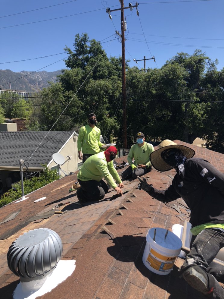 Slide of Reno's Roofing