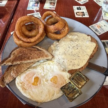 Carver's - Chicken fried steak with eggs over easy plus onion rings. - Breakfast & Brunch Near Me - Winter Park, Colorado Carver's - Chicken fried steak with eggs over easy plus onion rings. - Breakfast & Brunch Near Me - Winter Park, Colorado