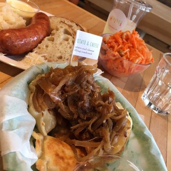 Baba's Pierogies - Small Order of Fried Potato & Cheese Pierogies with Caramelized Onions.  Kielbasy.  Carrot Salad.  Jasminade (Lemonade with Jasmine Tea). - Modern European Near Me - Brooklyn, New York