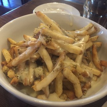 Seawolf - Garlic cheese fries, covered in fresh garlic, parsley, and gooey quality melted cheese - Pubs Near Me - Oakland, California Seawolf - Garlic cheese fries, covered in fresh garlic, parsley, and gooey quality melted cheese - Pubs Near Me - Oakland, California