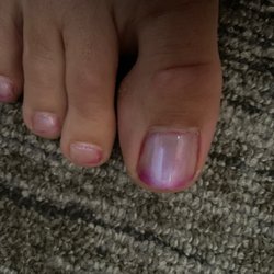 Summit Nail Spa - Entire toe was initially the bright pink color.  The color gradually faded away.