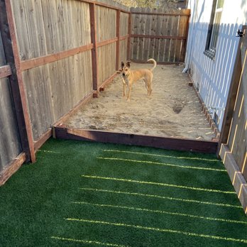 Bella View Landscape - Sandbox and faux grass in dog pen. - Landscaping Near Me