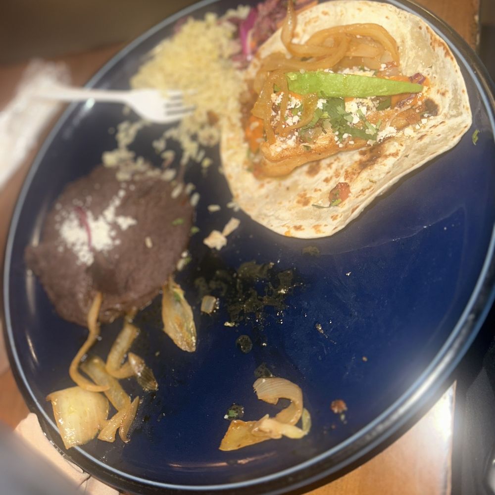 Petra - He had the chicken Mexican taco as you can see I couldn't even get a photo lol - Mexican Near Me - McKinney, Texas