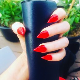 Full set gel polish. Mid-length stiletto style nail shape.