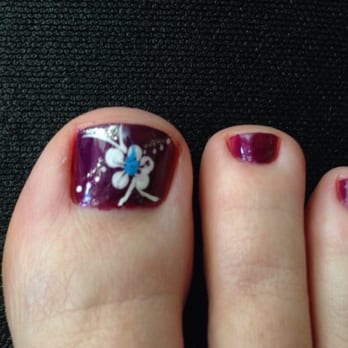 Passion Nails - I asked for a flower and got such a cute design on each big toe. I love it. Basic pedicure with detail was $25. - Nail Salons Near Me - Palm Desert, California