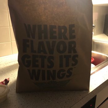 Wingstop - This is a pic of just the bag because we ate all the food and it was gone. It was so good. - Chicken Wings Near Me - Livonia, Michigan
