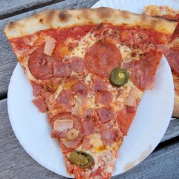two slices of pizza on a paper plate