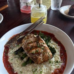 Dudley’s Sports Grill - Salmon on top of Parmesan Orzo and charred tomato vinaigrette and grilled broccolini