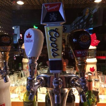 Sisters Pub & Grill - a row of beer taps - Burgers Near Me - Lethbridge, Alberta Sisters Pub & Grill - a row of beer taps - Burgers Near Me - Lethbridge, Alberta