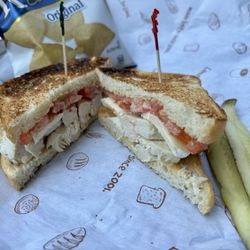 PureBread Deli - My create-your-own with rotisserie chicken, a bit of Brie, tomatoes, and their champagne mustard on toasted sourdough bread.
