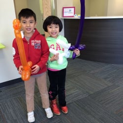 South Shore Pediatric Dentistry - Happy patients with balloon animals made by Dr. Sally! She can make a zoo and recite Dr. Suess!