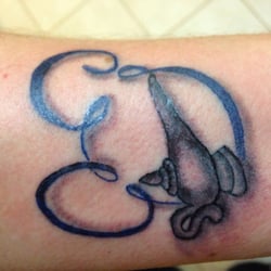 The Evil Emporium Of Tattoos - Aladdin lamp and Mickey shaped blue smoke.