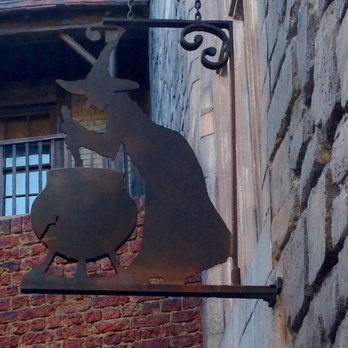 Leaky Cauldron™ - Exterior restaurant sign actually leaks water. - British Near Me - Orlando, Florida