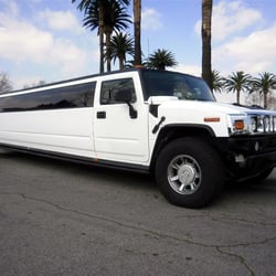 Patterson Limousine Service - White H2 Hummer limousines.